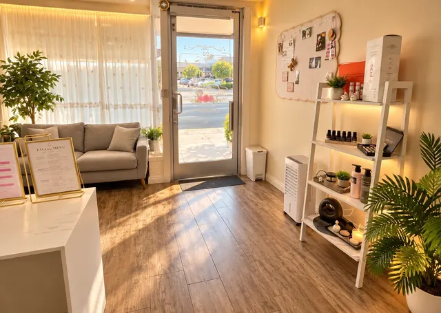 Sunlit spa entrance beside a waiting sofa and product shelf