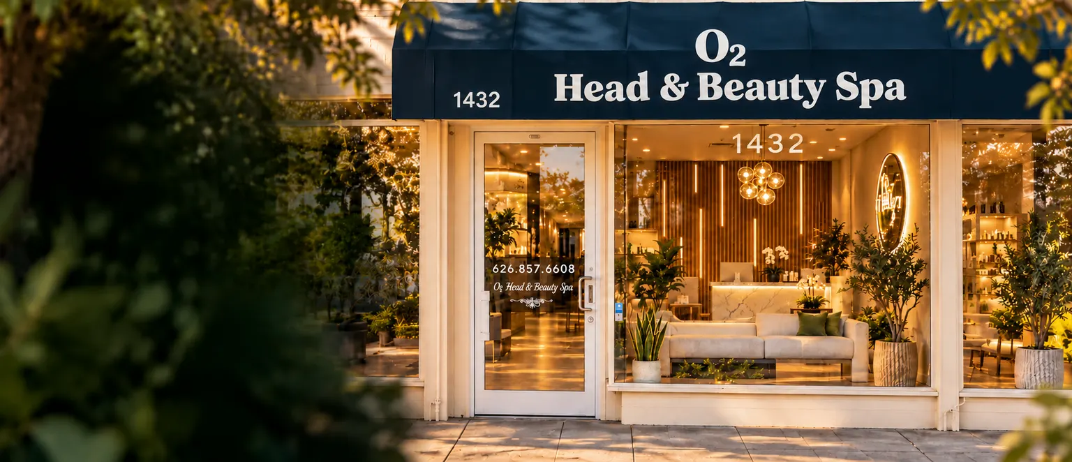 O2 Head & Beauty Spa in Arcadia, with its blue awning and warmly lit storefront