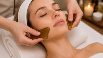 Jade Gua Sha Facial in Arcadia, with two gua sha tools gliding along the cheeks